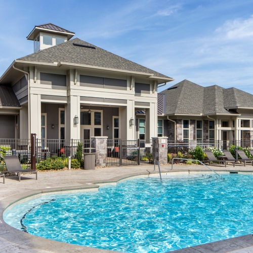 Pool is surrounded by plenty of lounge chairs Pool is surrounded by plenty of lounge chairs